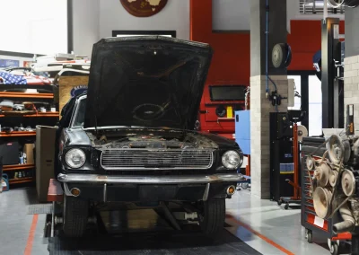 car being taking care of in workshop